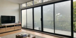 Privacy window film for homes applied to large sliding glass doors in a living room.