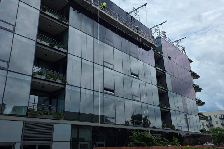 Applying Window Tint To A Glass Building